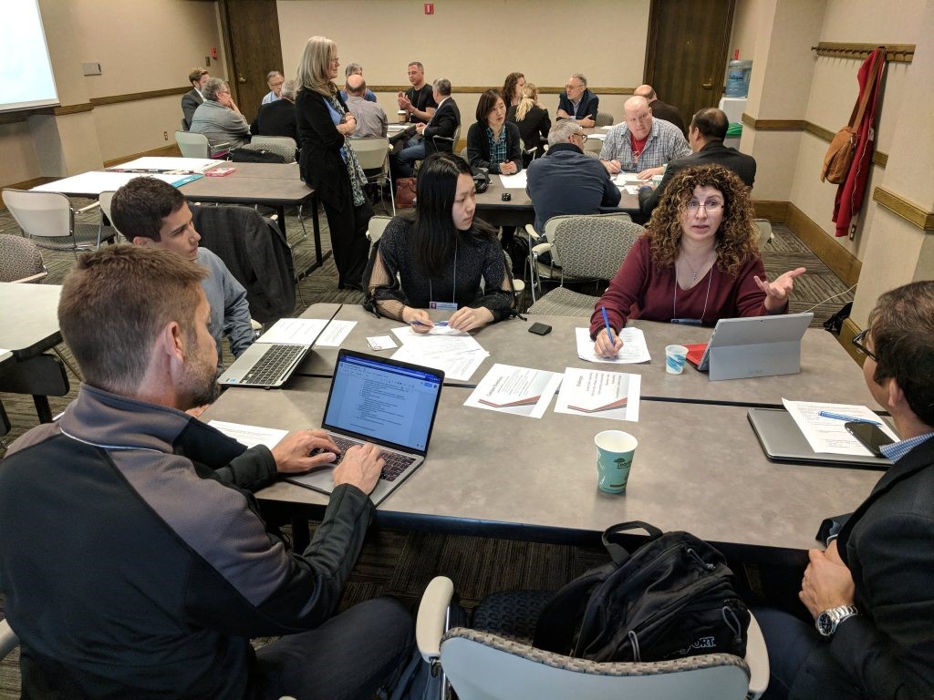 A photo of a discussion at the Learning Analytics Summit